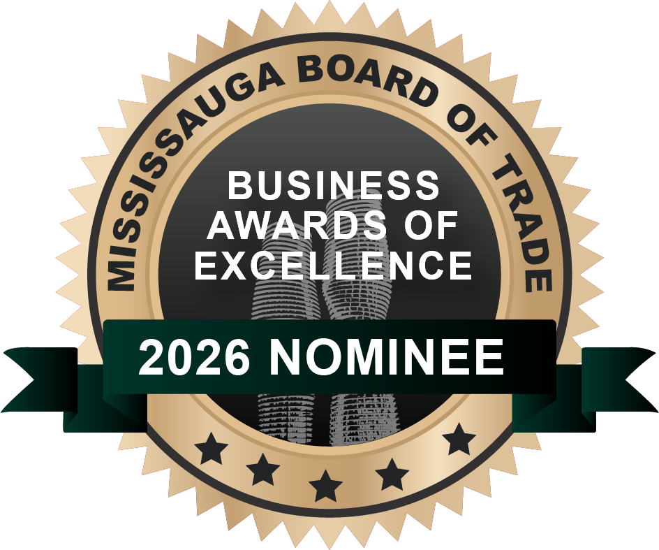 Gold circular award crest for the Mississauga Board of Trade Business Awards of Excellence, featuring a dark green ribbon across the centre that reads '2026 Nominee' in white capital letters. The background includes an illustration of the Absolute towers.