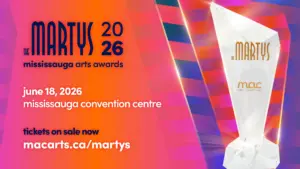 An event graphic for "THE MARTYS 2026 Mississauga Arts Awards," which will be held on June 18, 2026, at the Mississauga Convention Centre, with "tickets on sale now macarts.ca/martys" on the bottom-left. On the right, a faceted crystal trophy is displayed, showcasing "THE MARTYS" gold logo and a gold "Mississauga Arts Council" logo below it. The background displays an angular pattern in shades of red, pink, orange, purple, and blue.