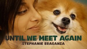A close up shot of Stephanie Braganza, smiling with a Pomeranian. Text over the bottom of the image reads, "Until We Meet Again" and "Stephanie Braganza"