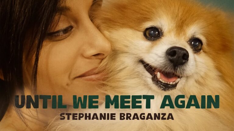 A close up shot of Stephanie Braganza, smiling with a Pomeranian. Text over the bottom of the image reads, "Until We Meet Again" and "Stephanie Braganza"