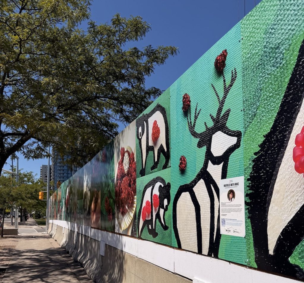 Largescale mural by Keitha Keeshig-Tobias. The mural features photography of her signature beaded berries. Some panels include multimedia pieces in which berries are stitched into canvas paintings with animals like bear and deer.